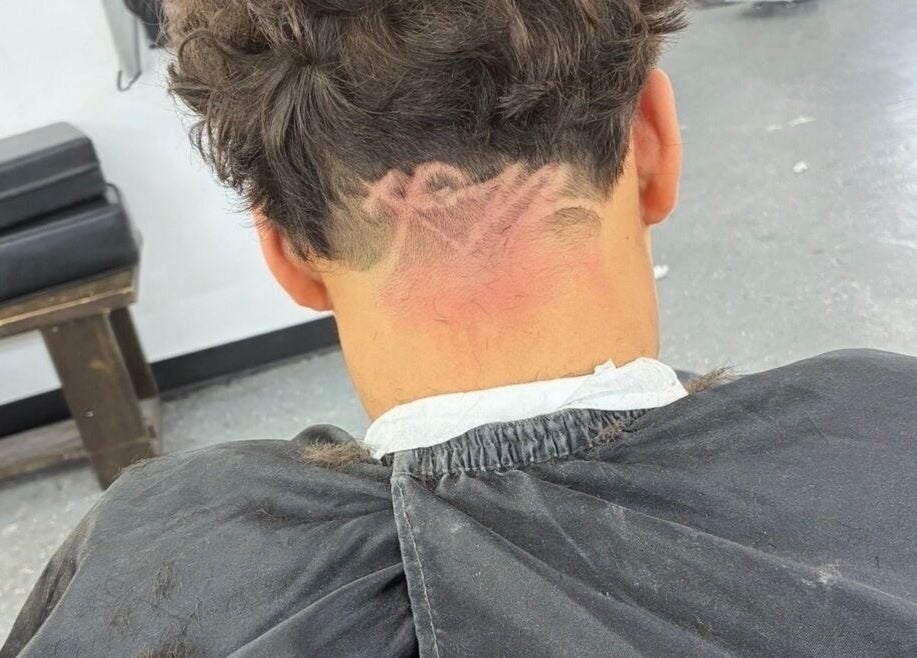 Unique hair design at davianscutzz in Dallas, Texas, US showcasing intricate barber skills.