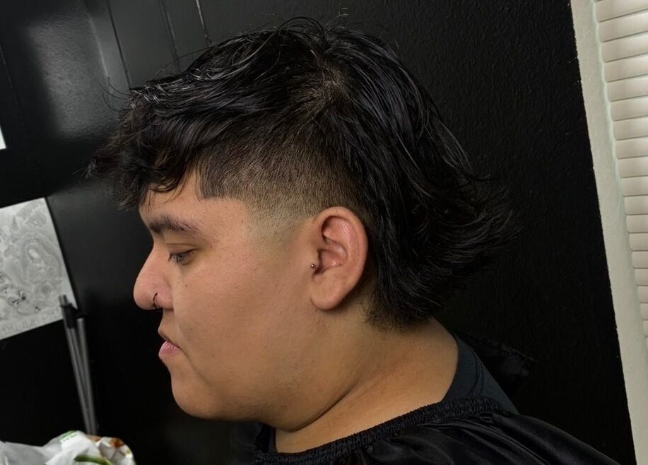 Modern mullet hairstyle at davianscutzz, Dallas, Texas, US, showcasing professional grooming and styling.