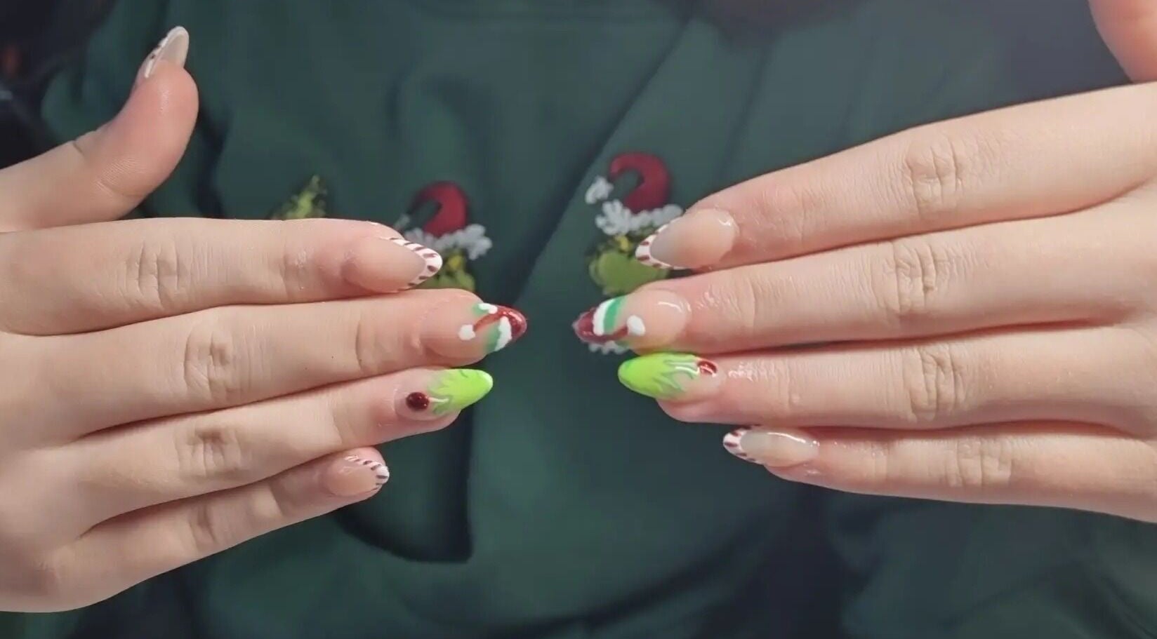 Vibrant holiday-themed nail art at Nails by Stacey in Bilston, England, GB, featuring red and green designs.