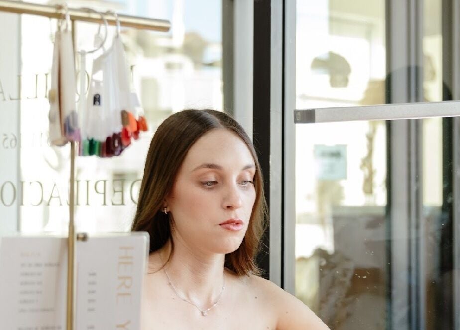 A woman enjoying a nail treatment at Beauty Art. Studio, Tijuana, Baja California, MX.