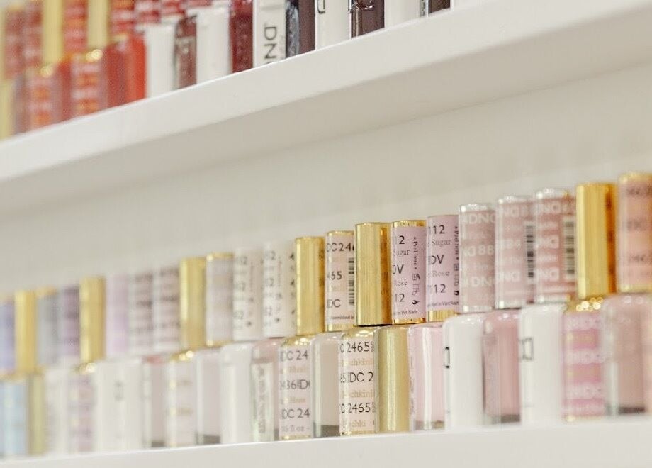 Colorful nail polish display at Beauty Art. Studio, Tijuana, Baja California, MX, showcasing diverse beauty options.