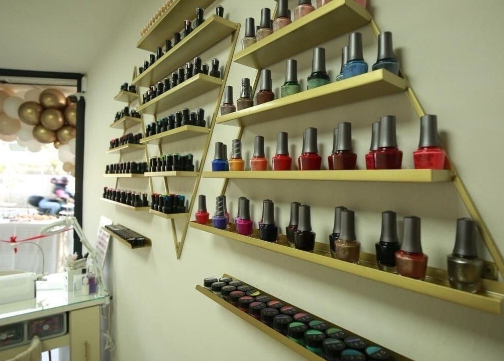 Colorful nail polish wall at Arza & Co, Ciudad De México, Ciudad De México, MX, showcasing vibrant beauty.