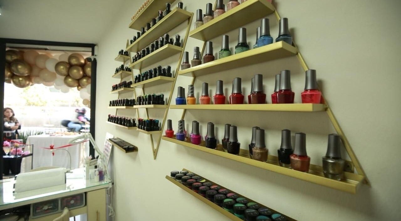 Colorful nail polish wall at Arza & Co, Ciudad De México, Ciudad De México, MX, showcasing vibrant beauty.