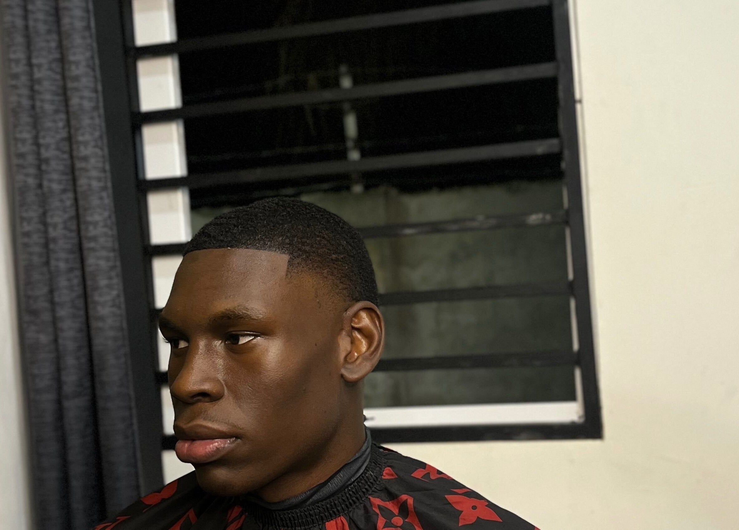 Client with a fresh fade at JAYHUNCHO the barber in Paramaribo, SR showcasing expert grooming.