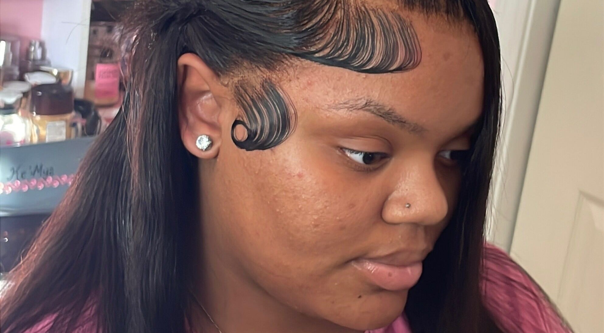 Detailed hairstyle showcasing sleek finger waves at LuxuryLaced, St. Marys, Georgia, US.