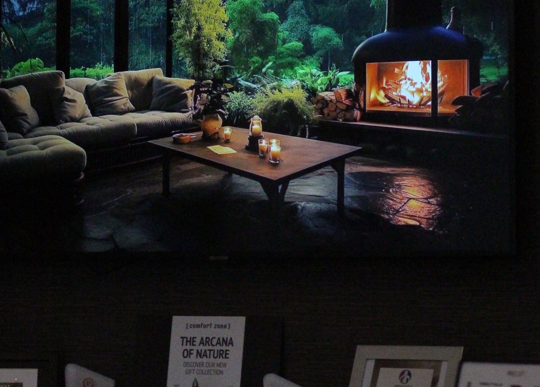 Cozy lounge with ambient lighting at Identity of Broughty Ferry, Dundee, Scotland, GB, featuring a warm fireplace.