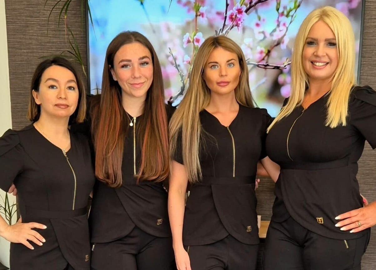 Friendly staff at Identity of Broughty Ferry in Dundee, Scotland, GB, showcasing their professional attire and welcoming smiles.