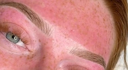 Close-up of well-groomed eyebrows with natural freckles, at By Resiân in Coventry, England, GB.