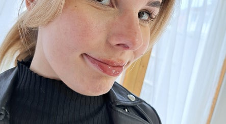 Close-up of a woman with a glossy smile at By Resiân, Coventry, England, GB.