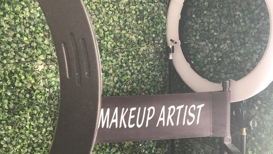 Makeup artist chair and ring light at Eunique Faces, Bridgetown, Saint Michael, BB, set against a green wall.