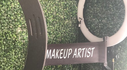 Makeup artist chair and ring light at Eunique Faces, Bridgetown, Saint Michael, BB, set against a green wall.