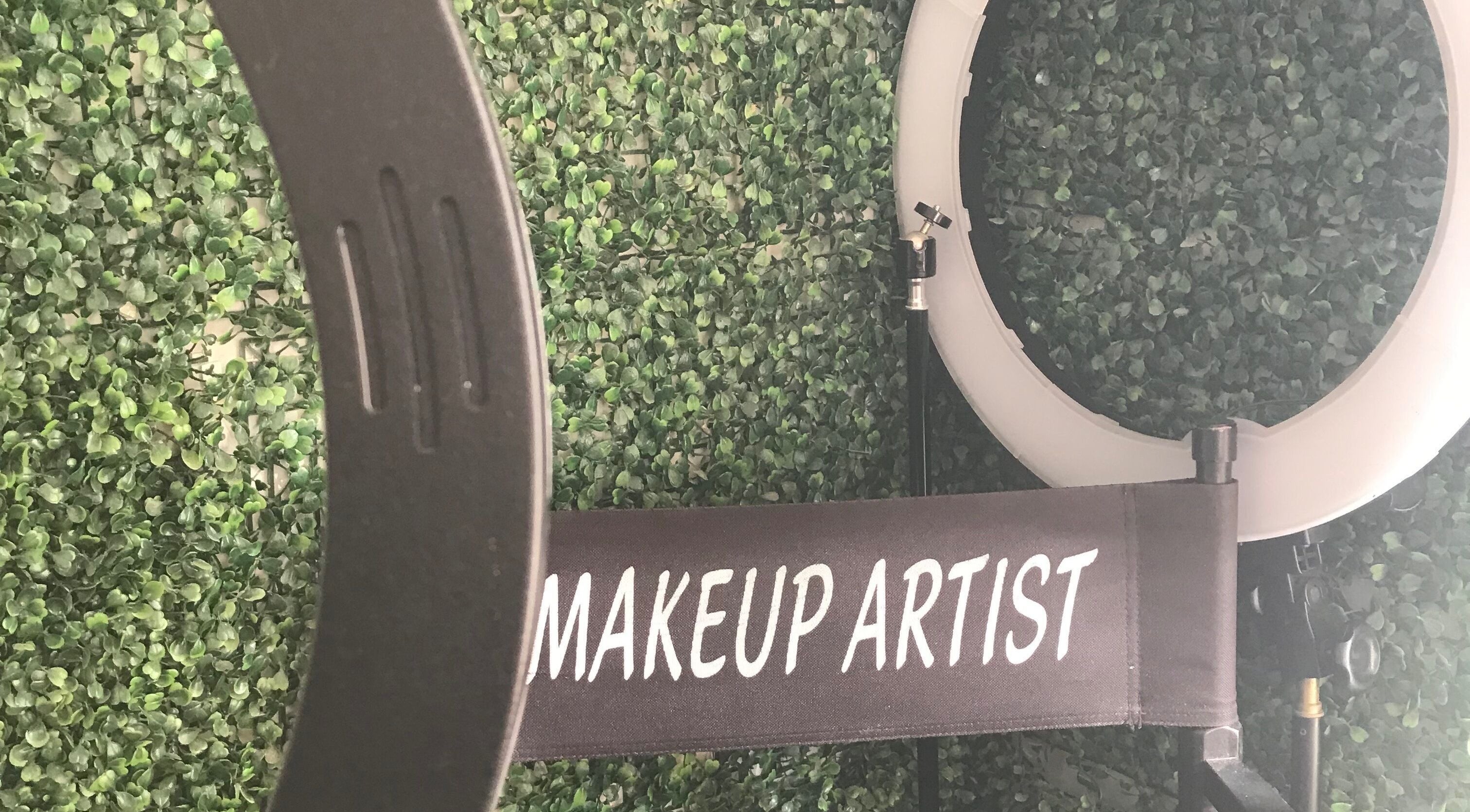 Makeup artist chair and ring light at Eunique Faces, Bridgetown, Saint Michael, BB, set against a green wall.