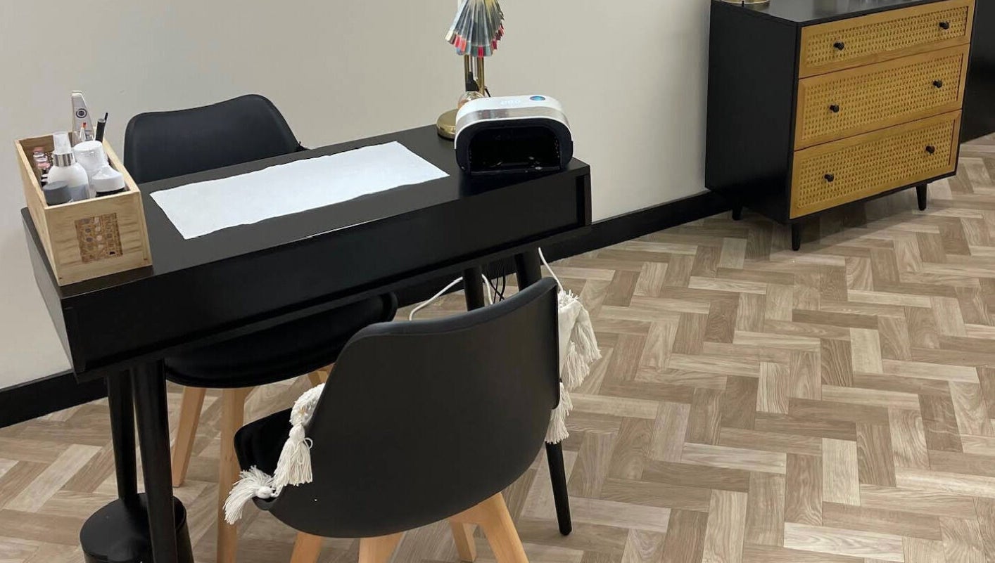 Nail station at Maia Emily Beauty in Derby, England, GB showcasing a sleek black table and modern décor.