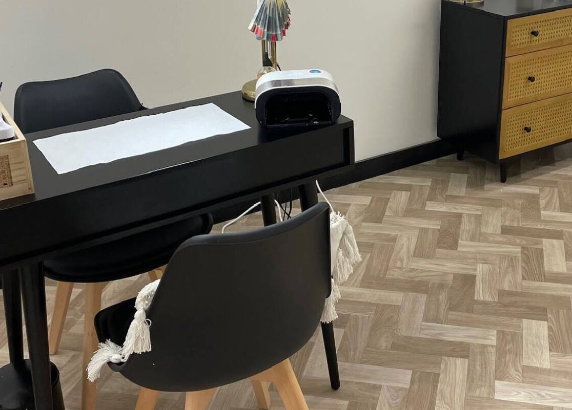 Nail station at Maia Emily Beauty in Derby, England, GB showcasing a sleek black table and modern décor.