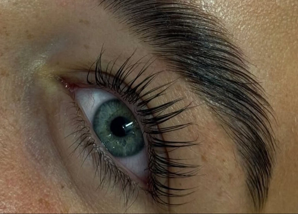 Detailed closeup of expertly shaped brows at Maia Emily Beauty in Derby, England, GB showcasing lush eyelashes.