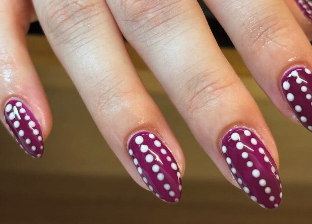 Polished nails with white dot design at Maia Emily Beauty, Derby, England, GB.