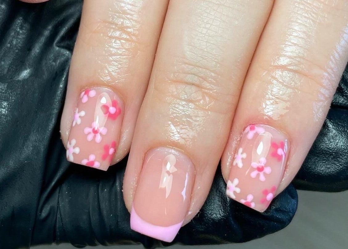Floral nail design at Maia Emily Beauty, Derby, England, GB, showcasing detailed pink and white blossoms.