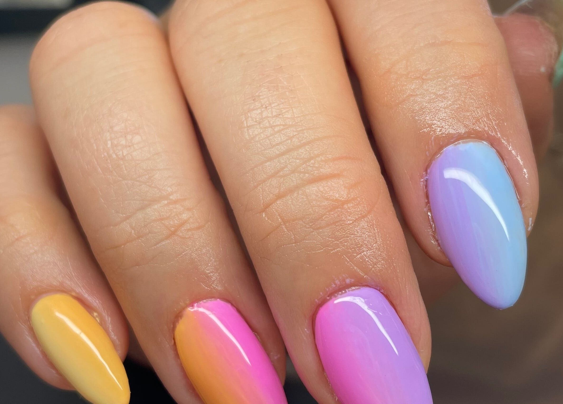 Pastel ombre nails at Josephine's Beauty, Thorrington, England, GB. Vibrant and stylish manicure.