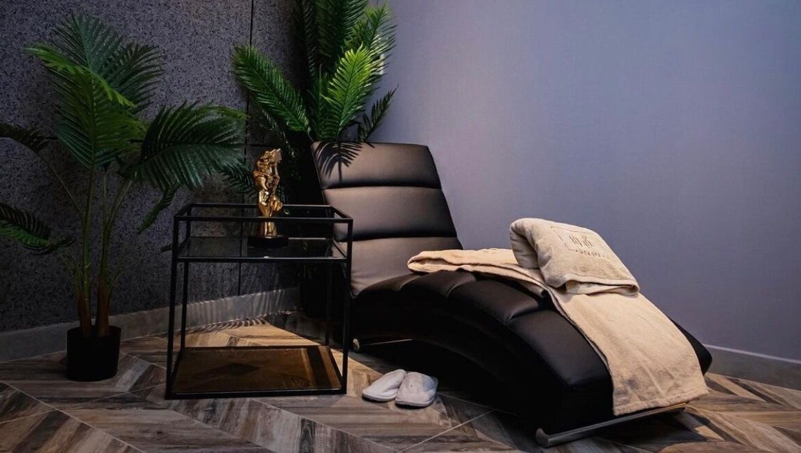 Luxurious spa lounge at 1948 in Muscat, Muscat Governorate, OM with plush seating and calming decor.