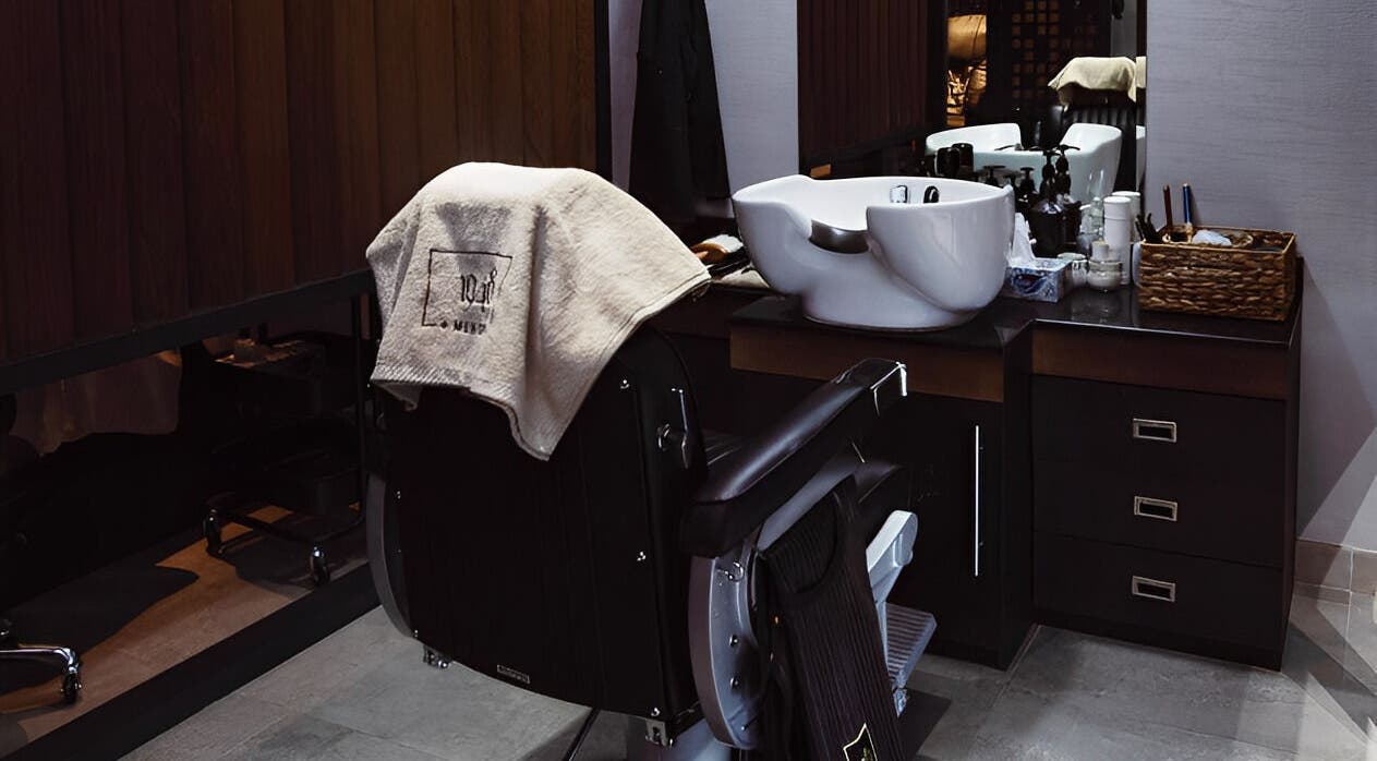 Luxurious salon chair and washbasin at 1948, Muscat, Muscat Governorate, OM, offering premium services.