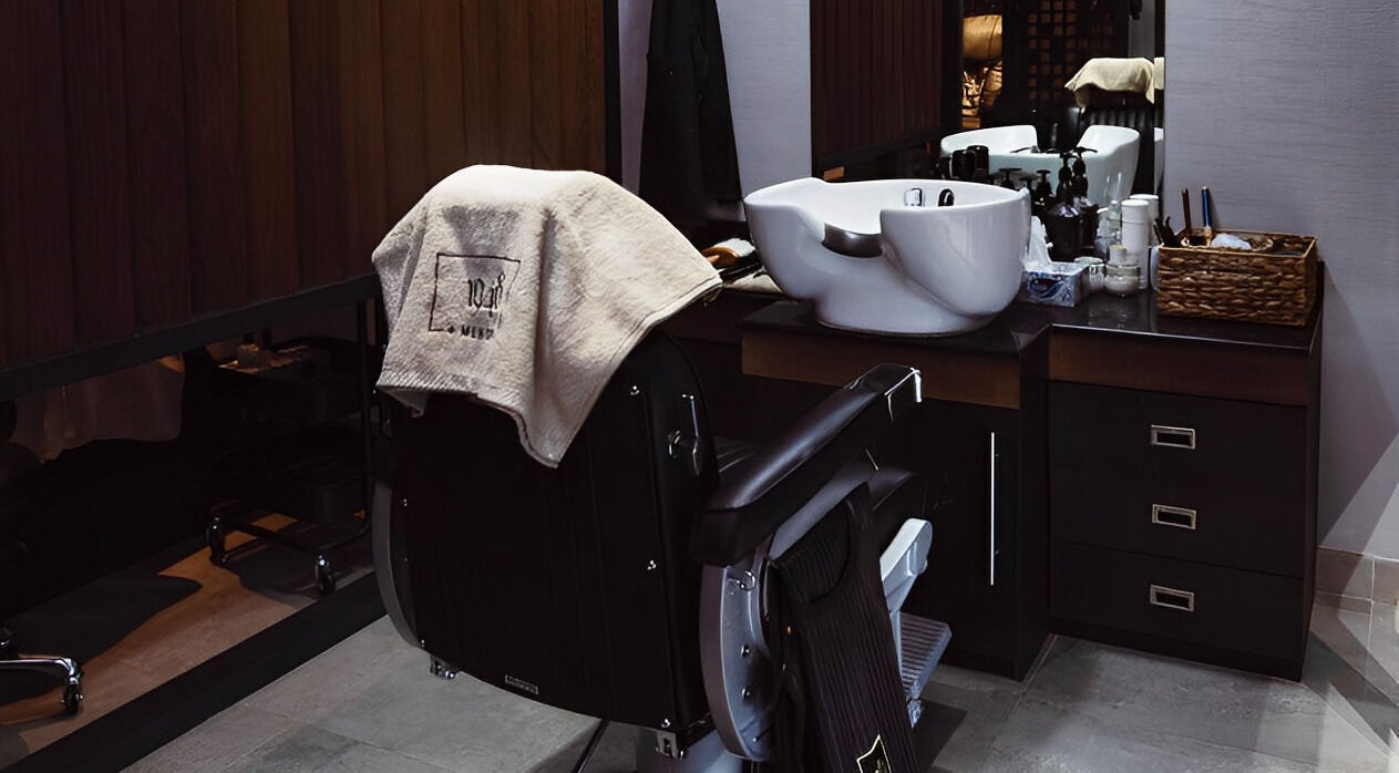 Luxurious salon chair and washbasin at 1948, Muscat, Muscat Governorate, OM, offering premium services.