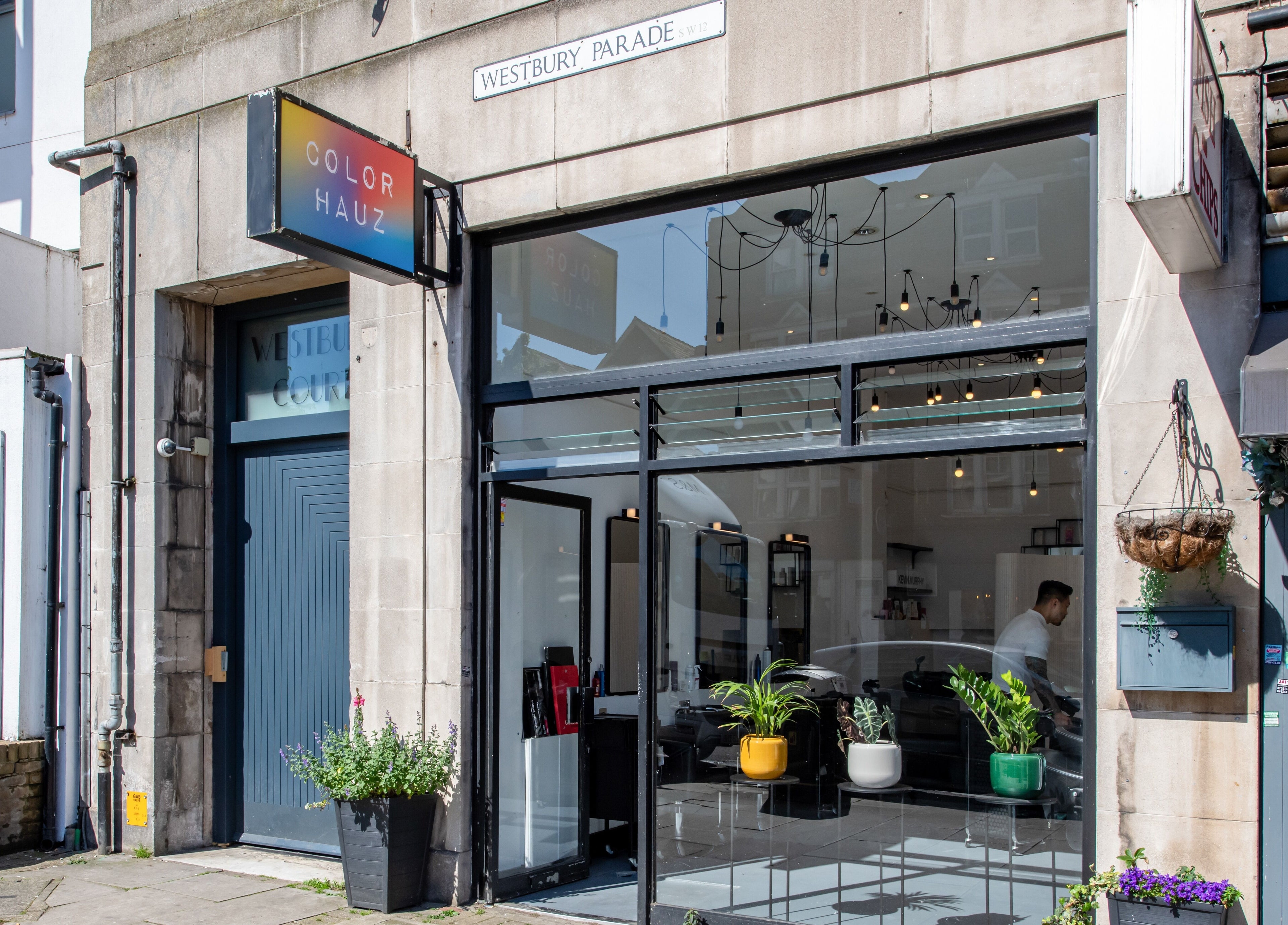 Colour Hauz storefront in London, England, GB with chic modern decor and large glass windows.
