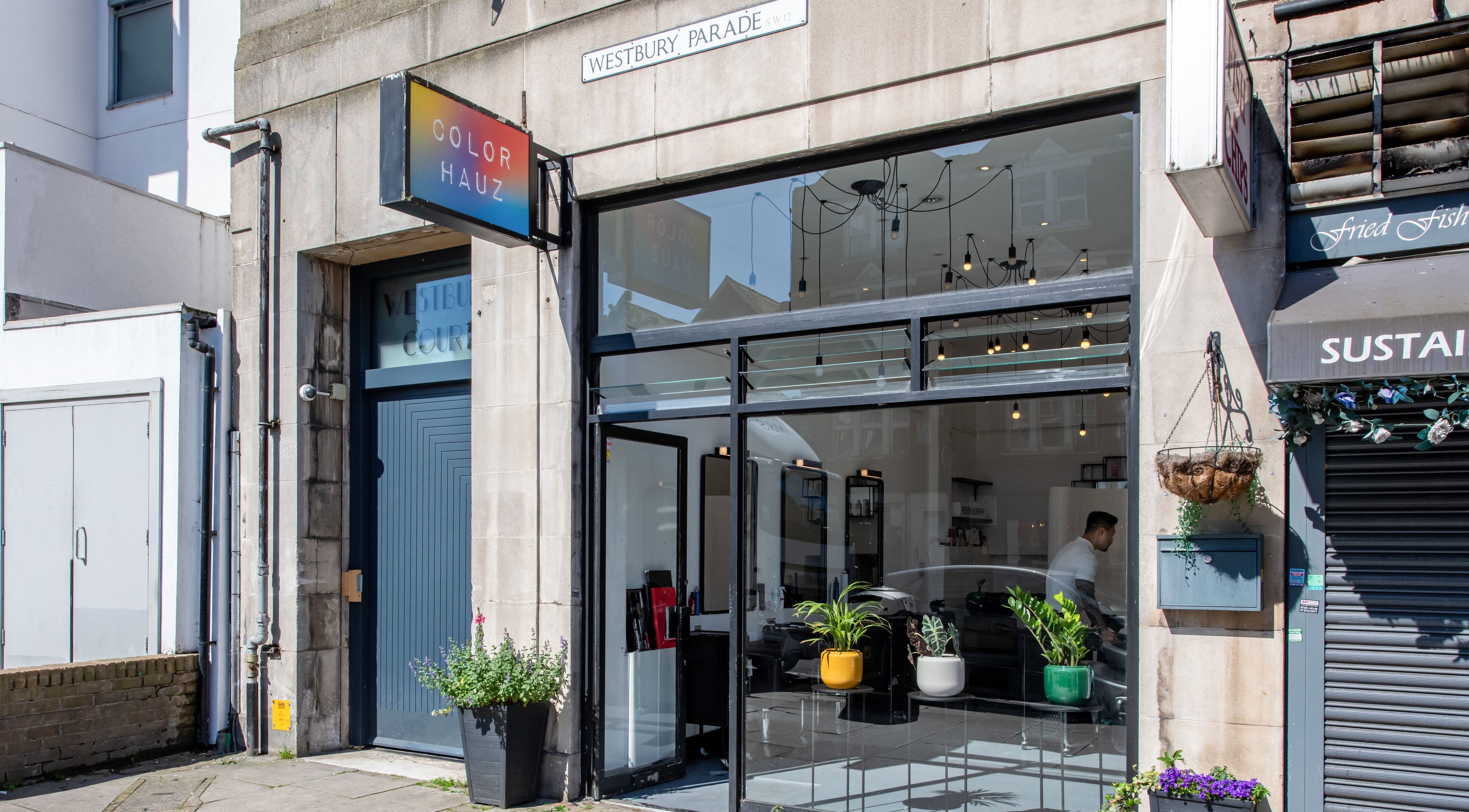 Colour Hauz storefront in London, England, GB with chic modern decor and large glass windows.