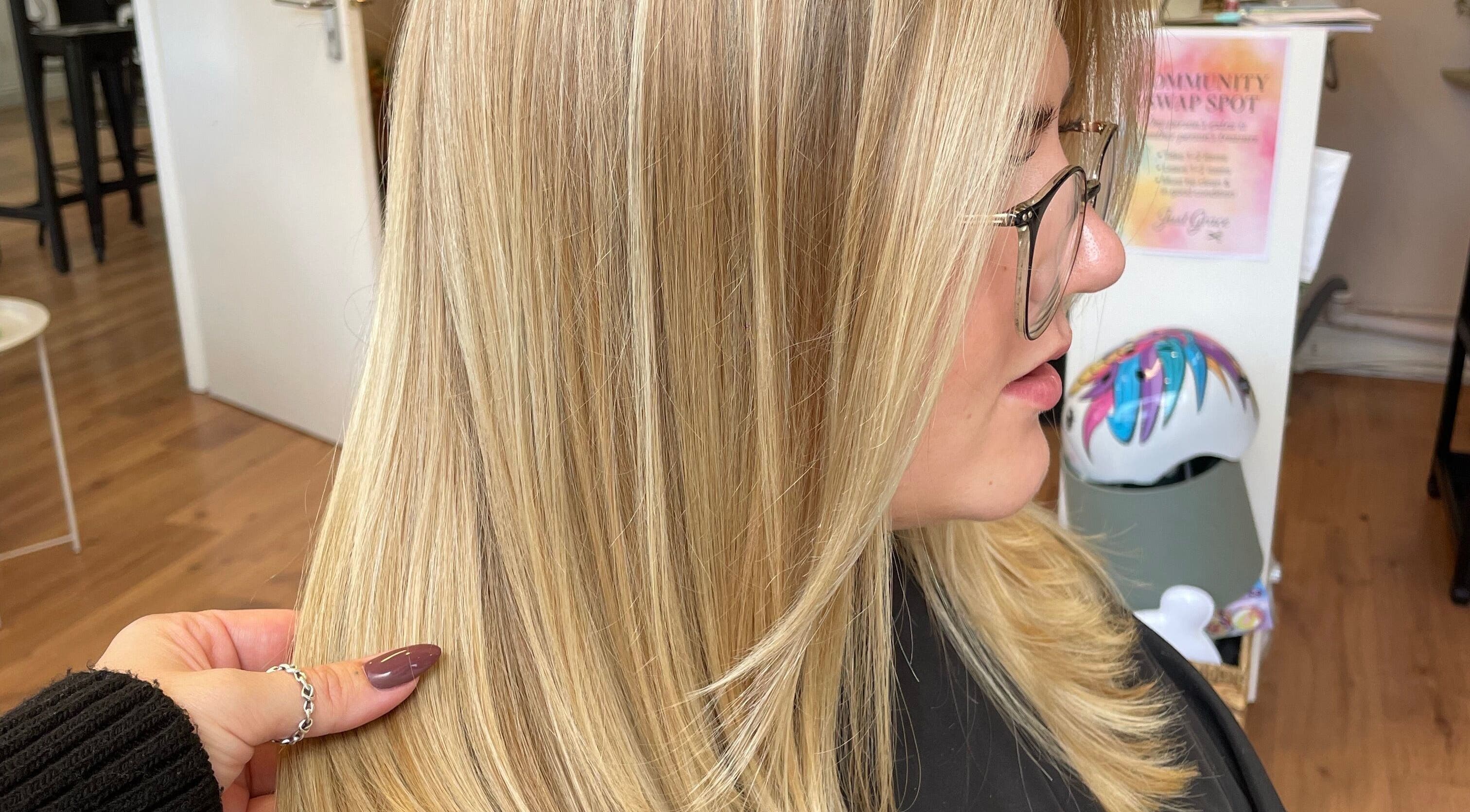 Blonde hair styled with precision at Just Grace Hairdressing, Northampton, England, GB for a sleek look.