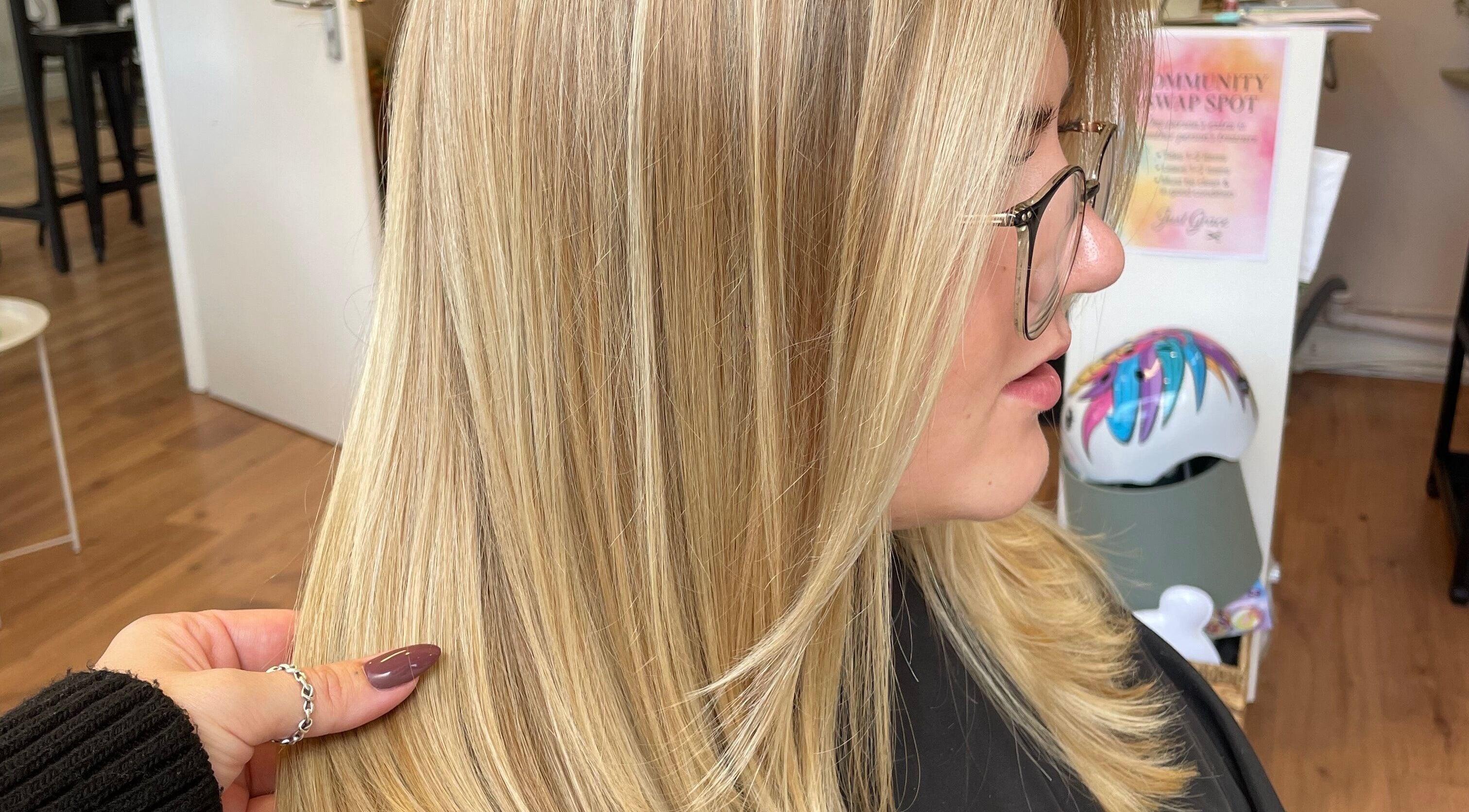 Blonde hair styled with precision at Just Grace Hairdressing, Northampton, England, GB for a sleek look.