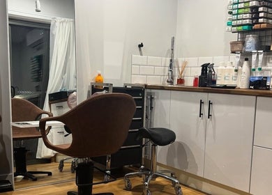 Elegant salon interior at Smart Hair Studio, Terang, Victoria, AU, featuring styling chairs and products.