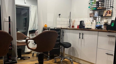 Elegant salon interior at Smart Hair Studio, Terang, Victoria, AU, featuring styling chairs and products.