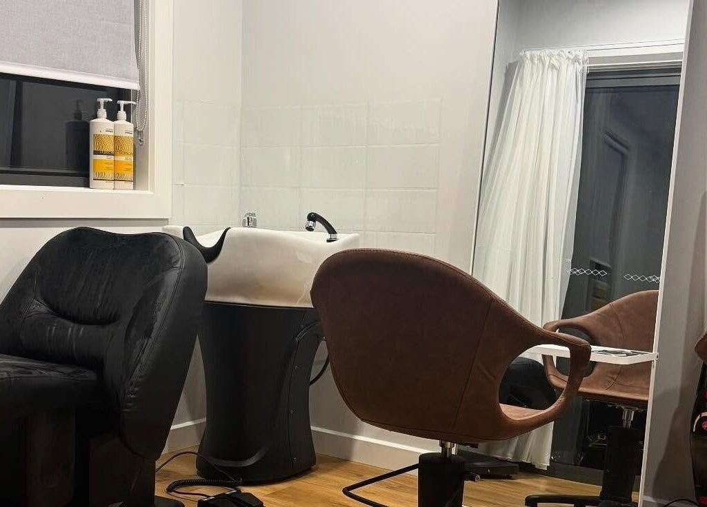 Chic interior of Smart Hair Studio in Terang, Victoria, AU, featuring a stylish salon chair and sink.