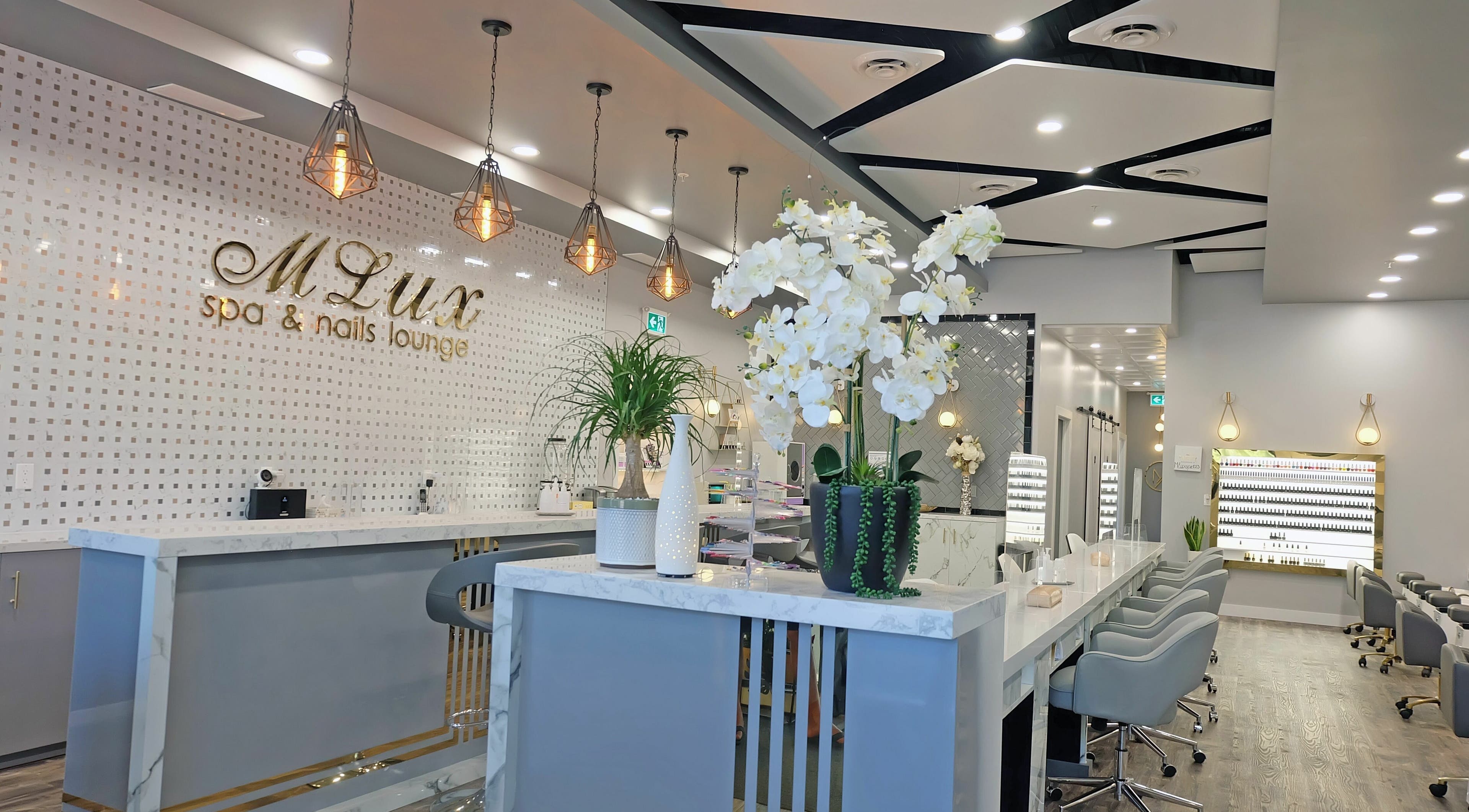 Modern interior of MLux Spa & Nails Lounge, Red Deer, Alberta, CA, featuring stylish decor and chic lighting.