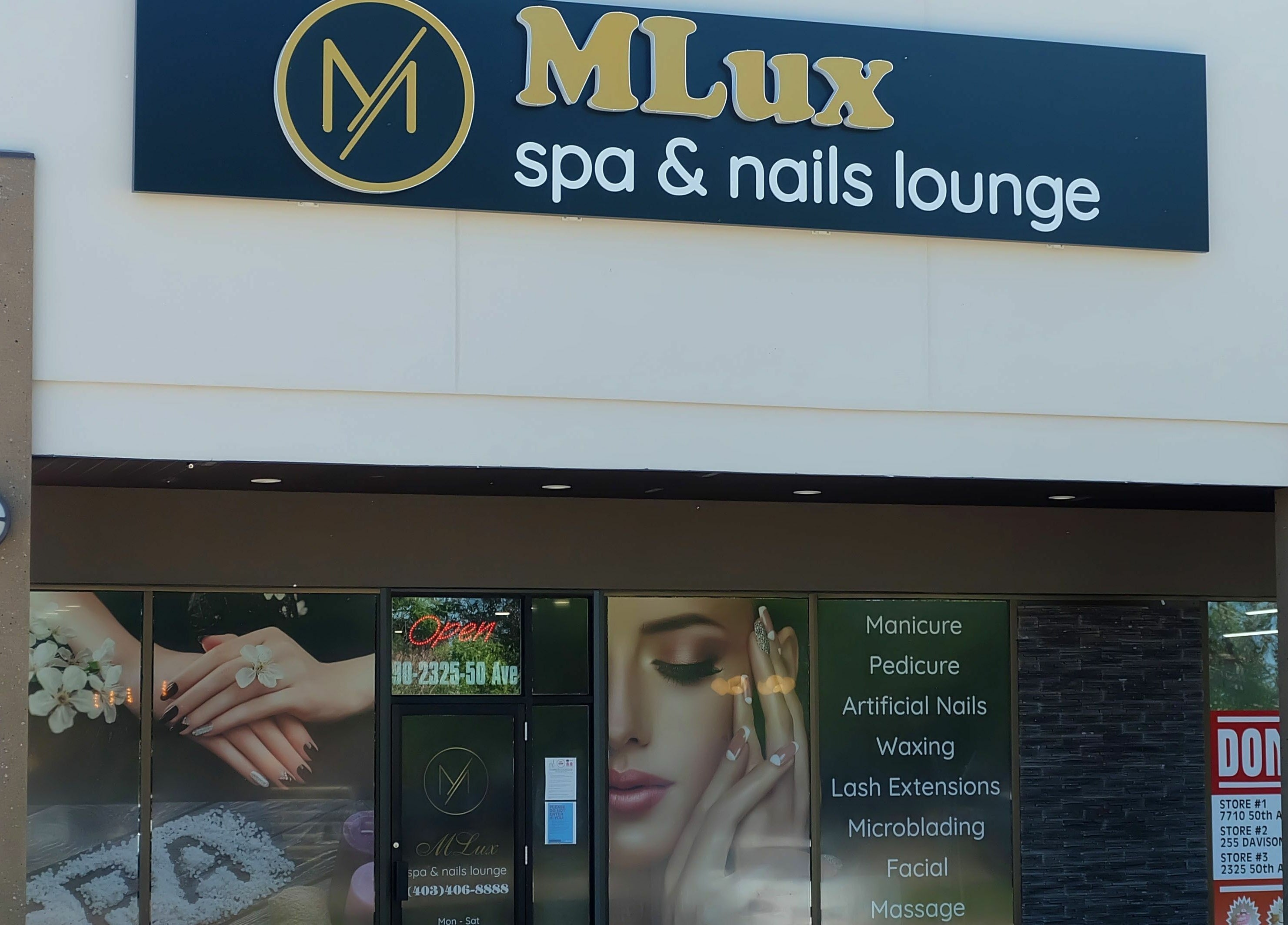Front view of MLux Spa & Nails Lounge in Red Deer, Alberta, CA, showcasing a modern design and services list.
