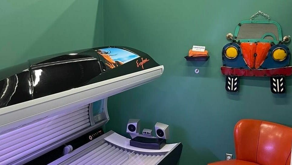 Tanning bed in Industry Salon and Tanning, Chatham-Kent, Ontario, CA, with vibrant decor and comfortable seating.