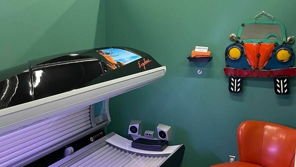 Tanning bed in Industry Salon and Tanning, Chatham-Kent, Ontario, CA, with vibrant decor and comfortable seating.