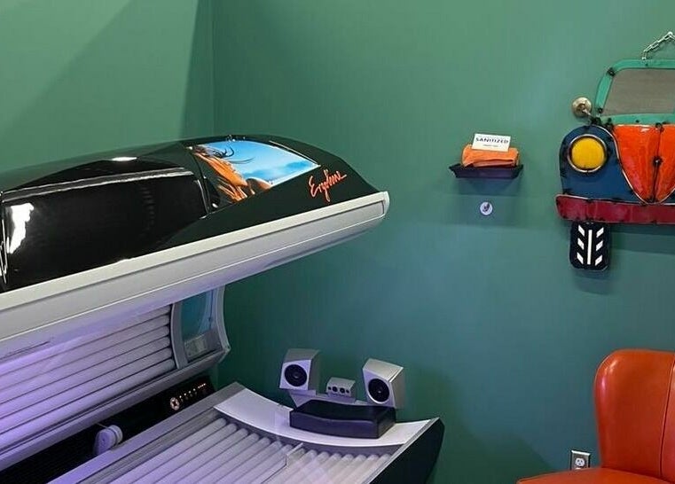 Tanning bed in Industry Salon and Tanning, Chatham-Kent, Ontario, CA, with vibrant decor and comfortable seating.