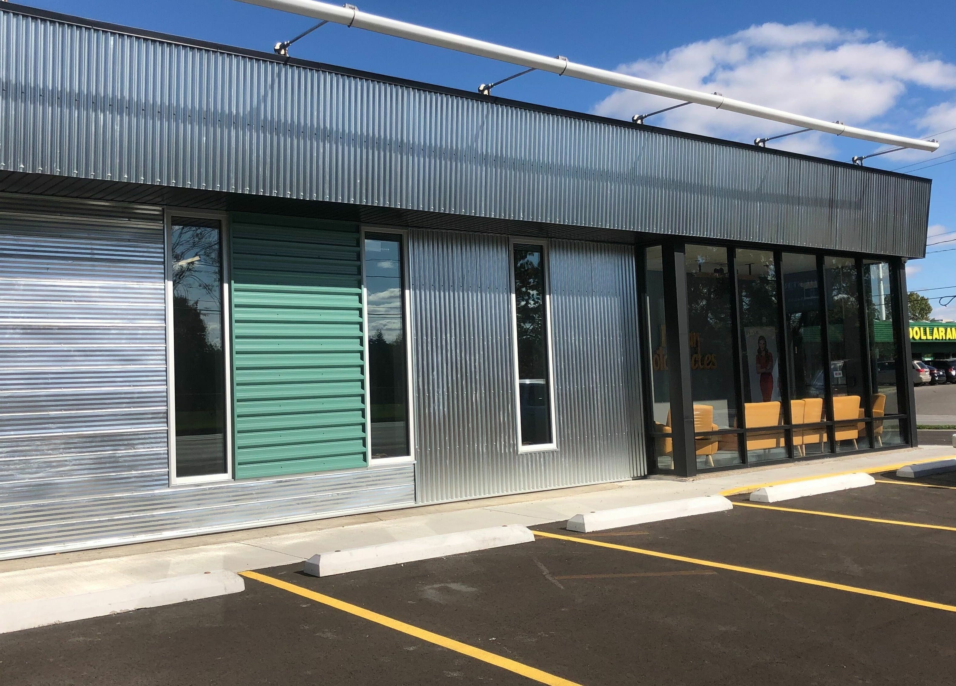 Industry Salon and Tanning's modern exterior located in Chatham-Kent, Ontario, CA with parking access.