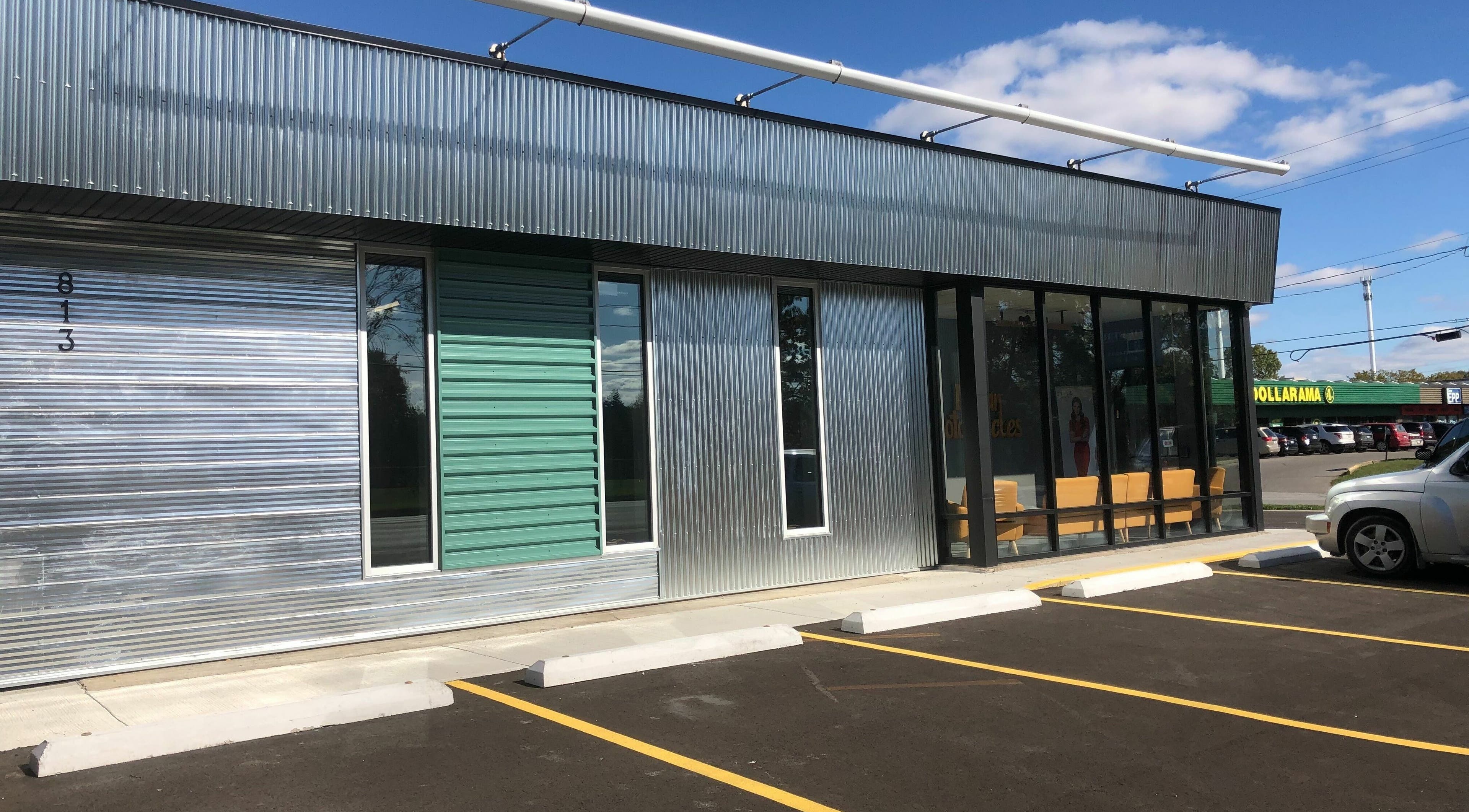 Industry Salon and Tanning's modern exterior located in Chatham-Kent, Ontario, CA with parking access.