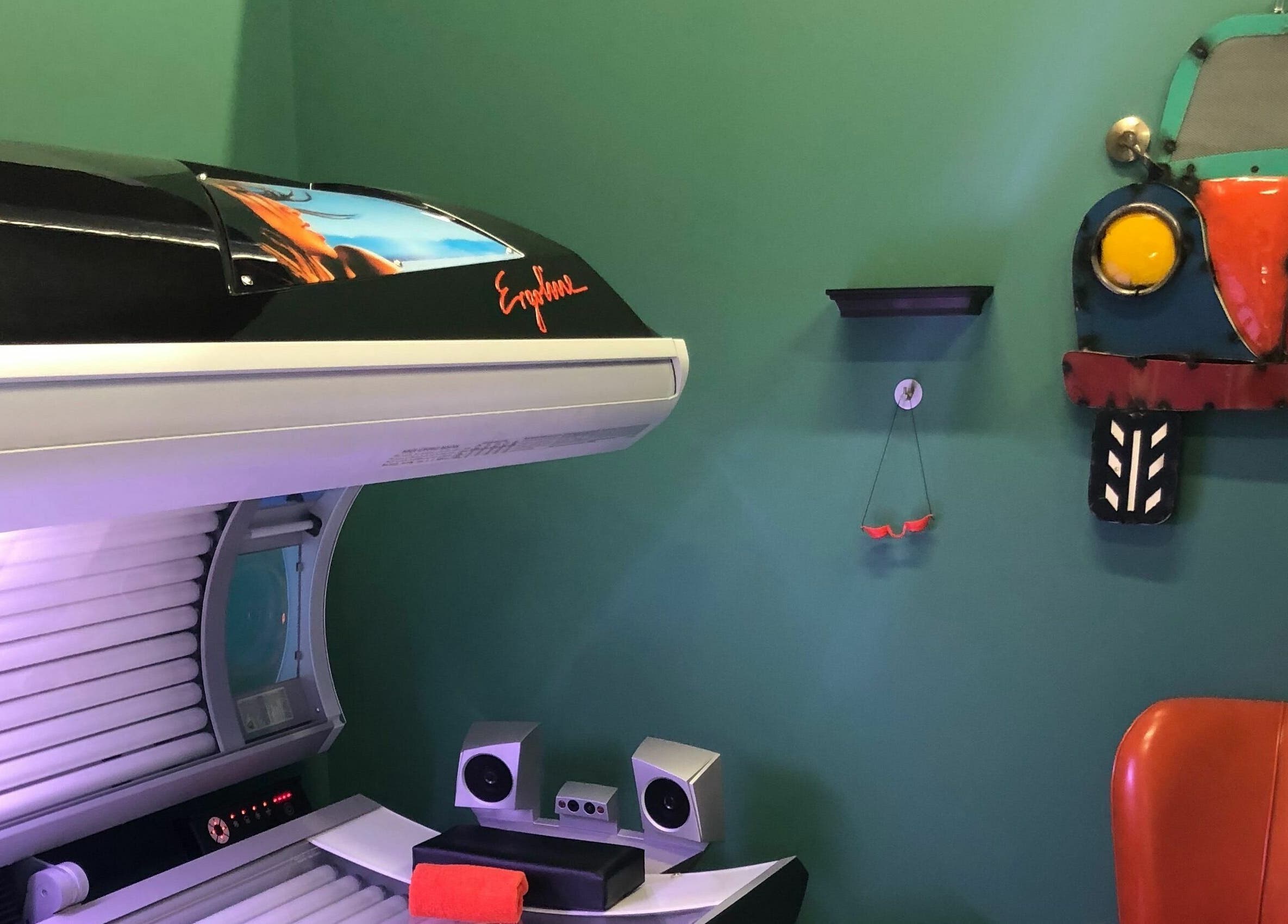 Tanning bed at Industry Salon and Tanning in Chatham-Kent, Ontario, CA with retro car decor.