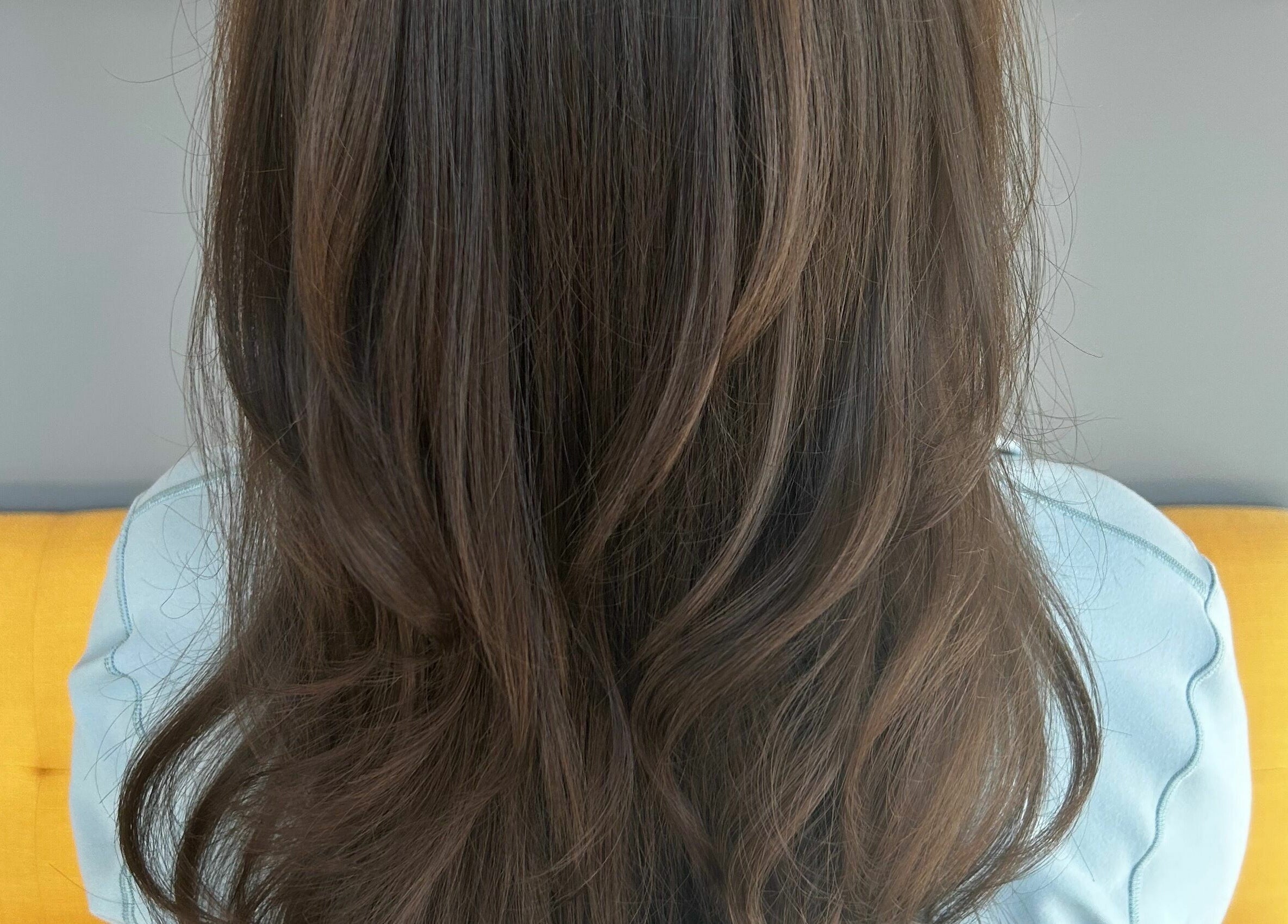 Glossy brown hair styled perfectly at Industry Salon and Tanning, Chatham-Kent, Ontario, CA.