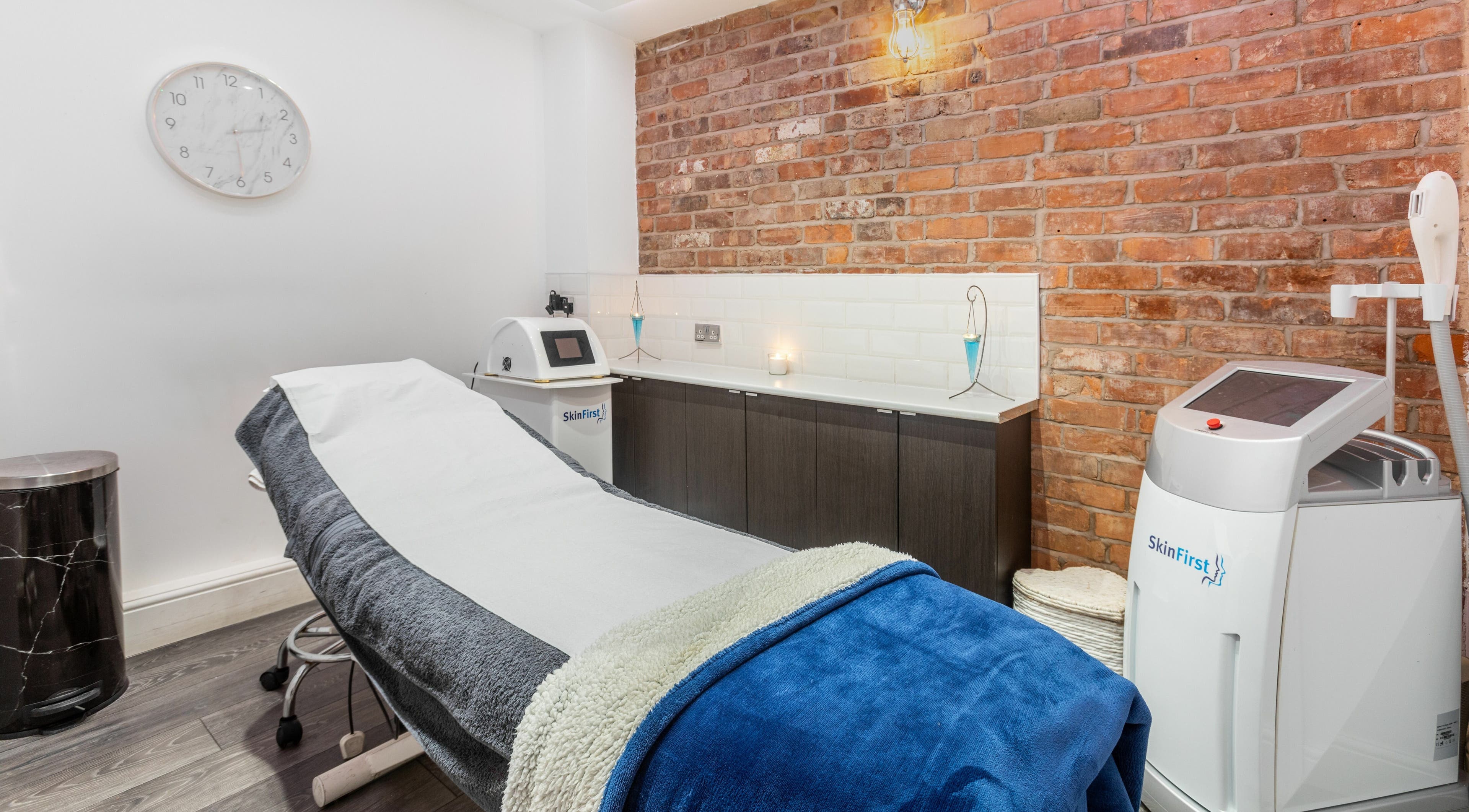 Relaxing treatment room at Skinfirst - Warrington with modern equipment and cozy decor, Warrington, England, GB.