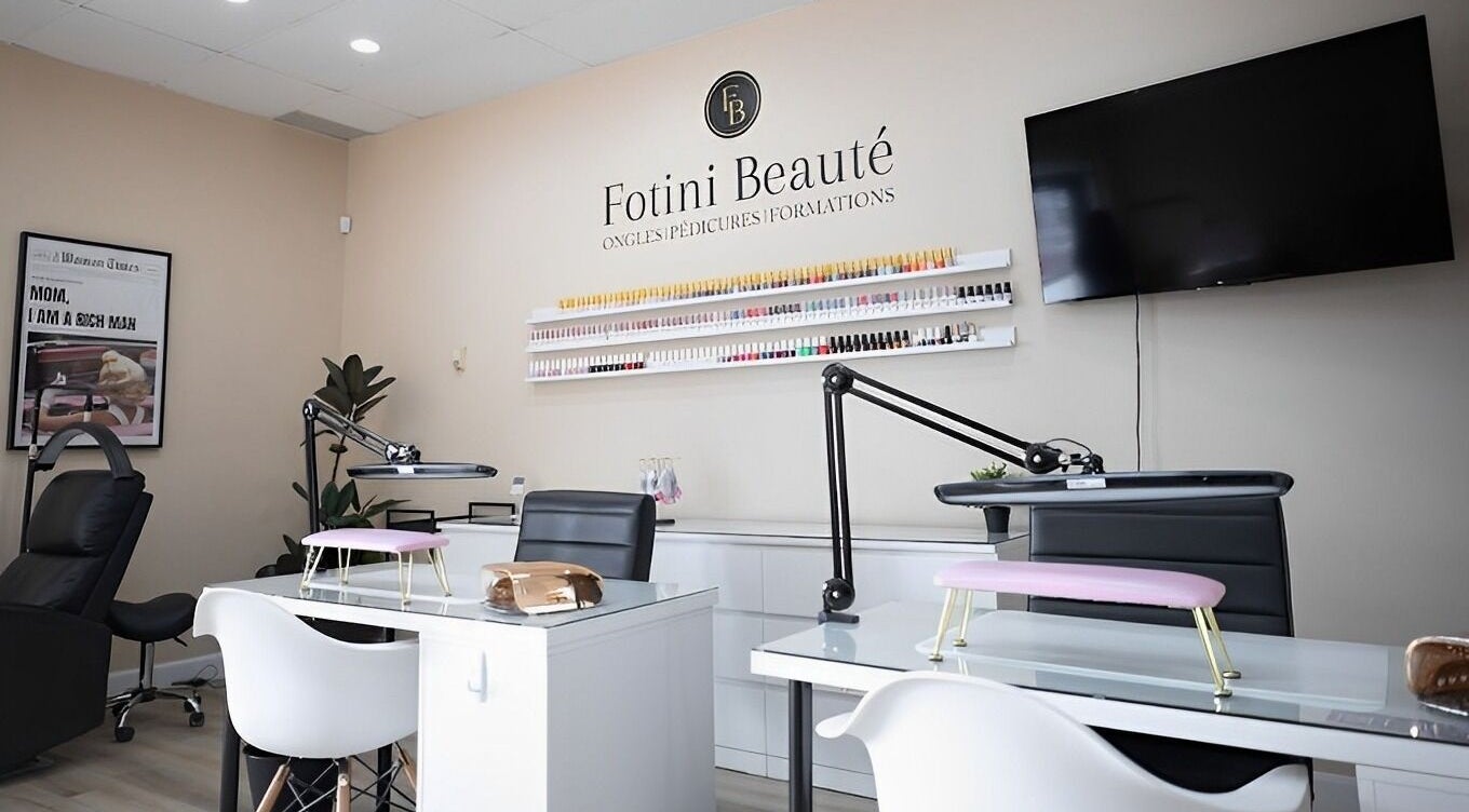 Sophisticated nail salon interior at Fotini Beauté, Laval, Québec, CA, showcasing modern manicure stations.