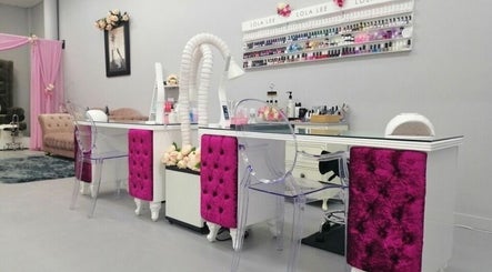 Elegant nail station at Flawless Face and Beauty Wellington, Wellington, NZ with plush seating and nail polish display.