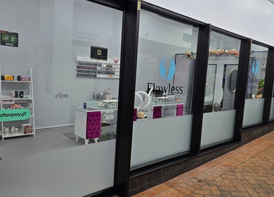 Entrance of Flawless Face and Beauty Wellington located in Wellington, NZ, showcasing a modern, elegant storefront.