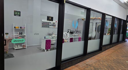 Entrance of Flawless Face and Beauty Wellington located in Wellington, NZ, showcasing a modern, elegant storefront.