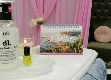 A calming spa setup at Flawless Face and Beauty Wellington, Wellington, NZ featuring lotion, oil, and decor.