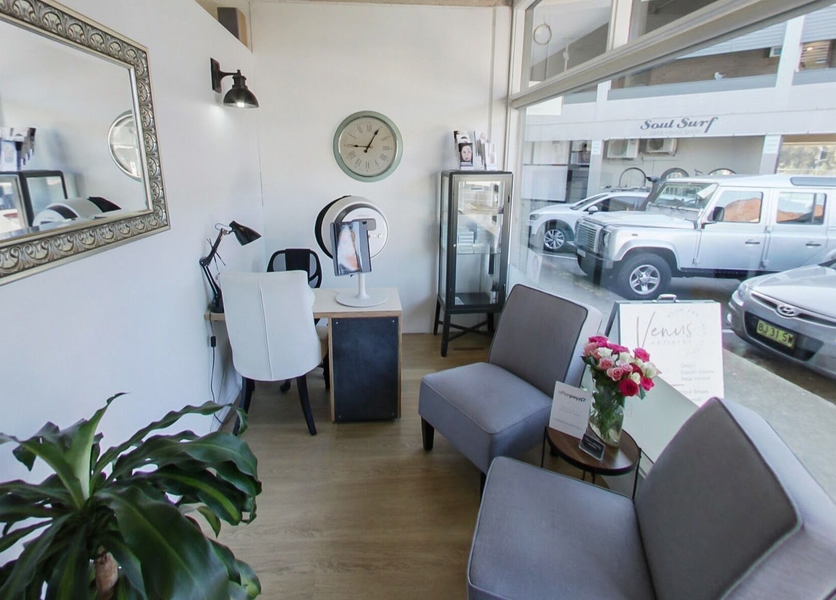 Bright interior of Venus Artistry Brow and Lash Studio in Sydney, New South Wales, AU, showcasing chairs and decor.