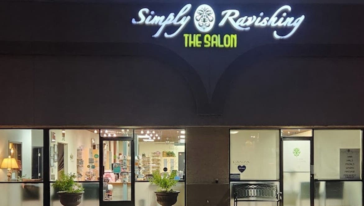 Exterior view of KV Skin Studio (Gilbert) at night showcasing bright signage in Gilbert, Arizona, US.