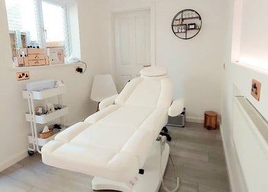 Tranquil treatment room at Mysa Beauty & Training in Godmanchester, England, GB with a plush white chair.